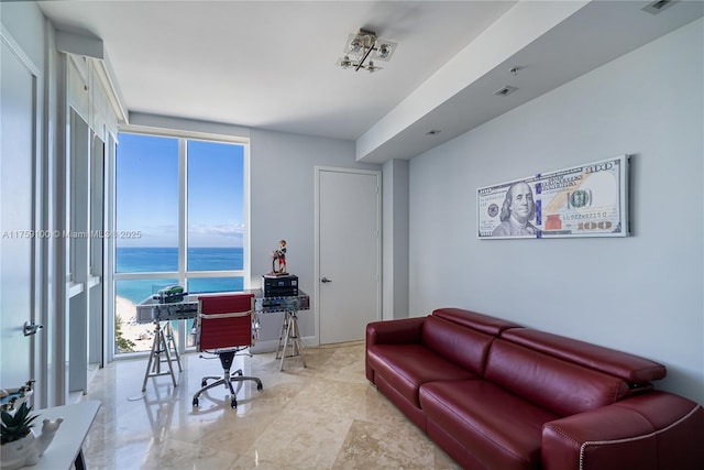 home office featuring a wall of windows, visible vents, and a water view