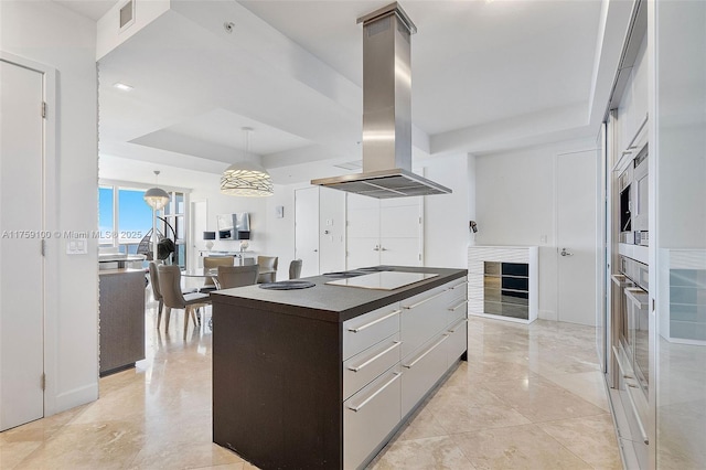 18201 Collins Ave Unit 4404, Sunny Isles Beach, FL 33160 - kitchen with island range hood, a tray ceiling, stovetop, beverage cooler, and dark countertops