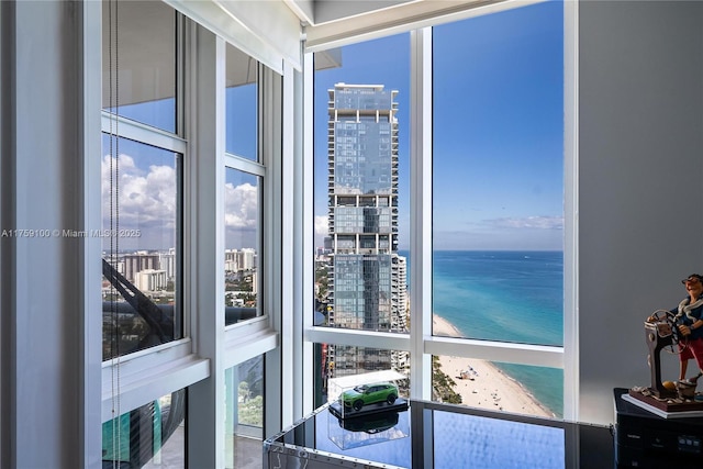 interior space featuring a water view and a city view