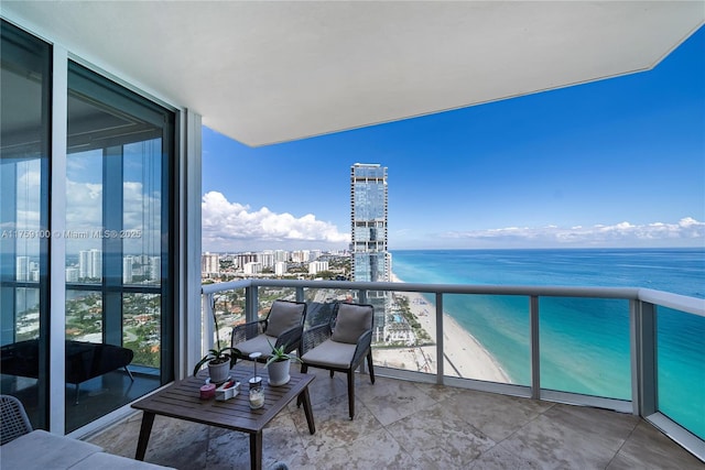 balcony with a water view and a city view