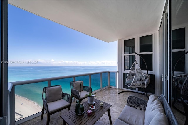 balcony with a view of the beach and a water view