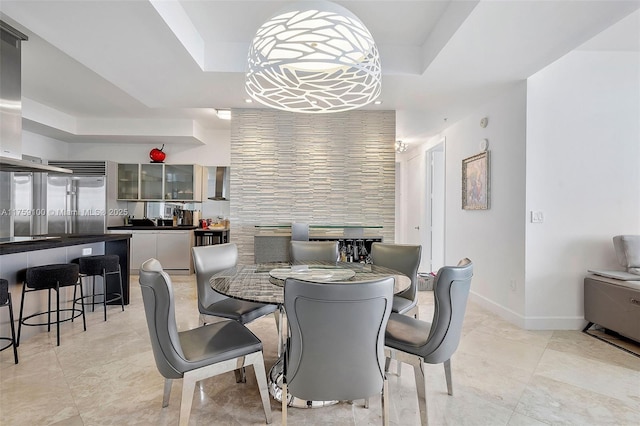 18201 Collins Ave Unit 4404, Sunny Isles Beach, FL 33160 - dining space with a raised ceiling and light tile patterned floors