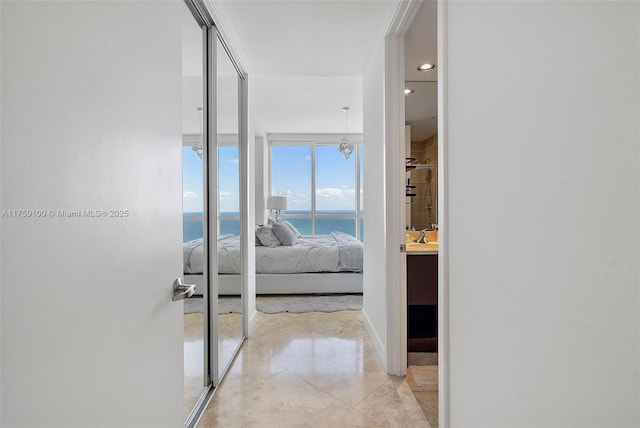 18201 Collins Ave Unit 4404, Sunny Isles Beach, FL 33160 - corridor featuring a water view and light tile patterned floors