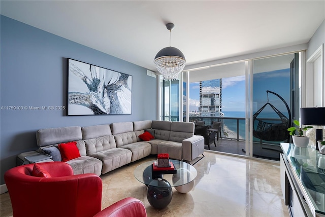 living area with floor to ceiling windows, a notable chandelier, and a water view