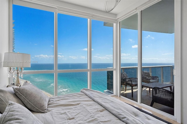 18201 Collins Ave Unit 4404, Sunny Isles Beach, FL 33160 - bedroom with expansive windows, a water view, and multiple windows