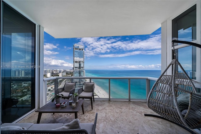 balcony featuring a view of city and a water view