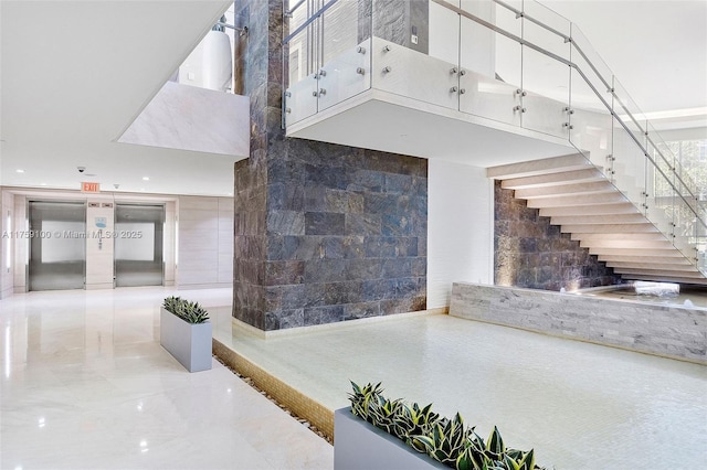 18201 Collins Ave Unit 4404, Sunny Isles Beach, FL 33160 - stairway with marble tiled flooring and recessed lighting