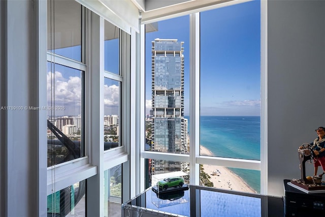 18201 Collins Ave Unit 4404, Sunny Isles Beach, FL 33160 - sunroom featuring a water view, a view of city, and plenty of natural light