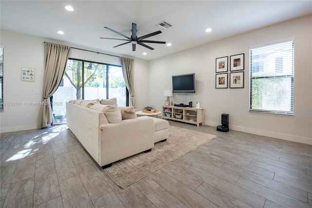 living area featuring recessed lighting, a healthy amount of sunlight, and light wood finished floors