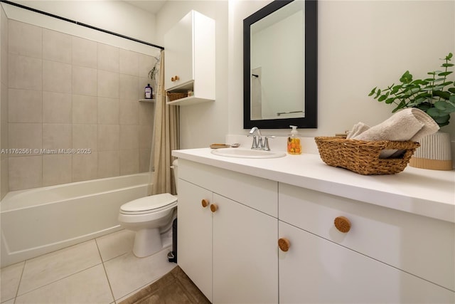 bathroom with tile patterned flooring, toilet, vanity, and shower / tub combo