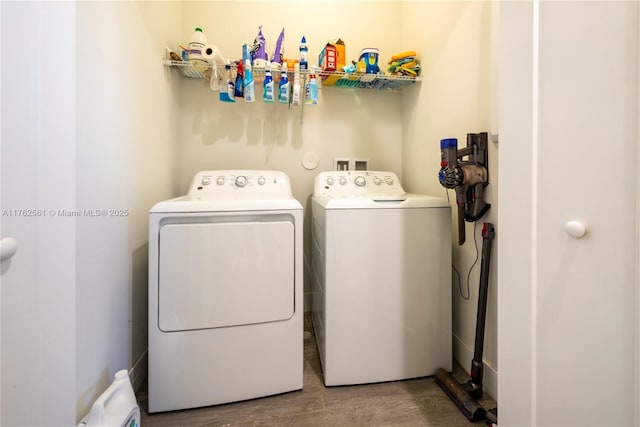 washroom with laundry area, independent washer and dryer, and wood finished floors