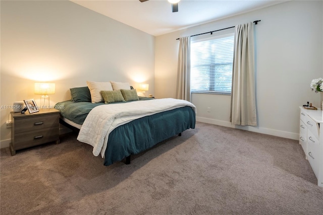 carpeted bedroom featuring baseboards and ceiling fan