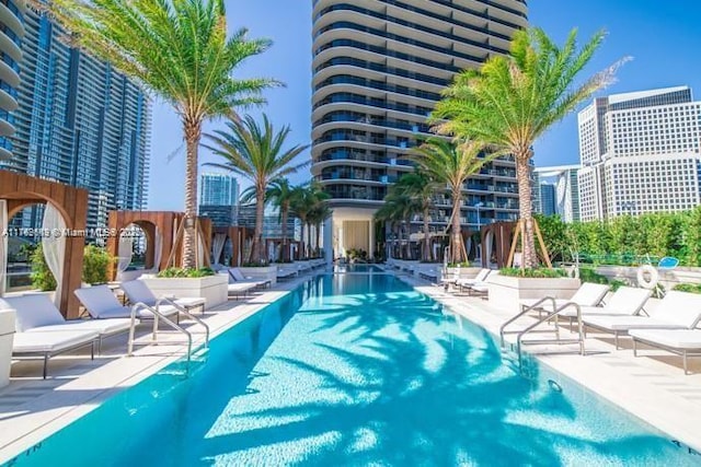 pool with a patio and a view of city