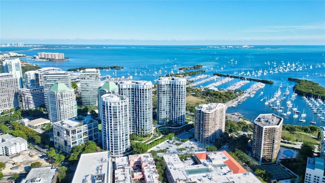 birds eye view of property with a water view and a view of city