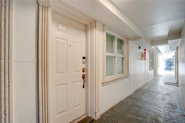 view of exterior entry featuring stucco siding