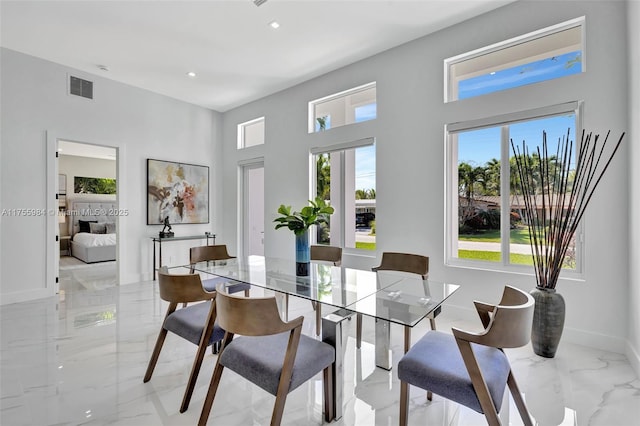 dining area featuring recessed lighting, visible vents, marble finish floor, and baseboards