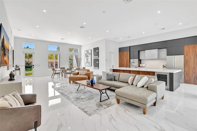 4440 NE 15th Ter, Oakland Park, FL 33334 - living room featuring marble finish floor, recessed lighting, visible vents, and beverage cooler