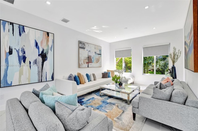 living room with recessed lighting and visible vents