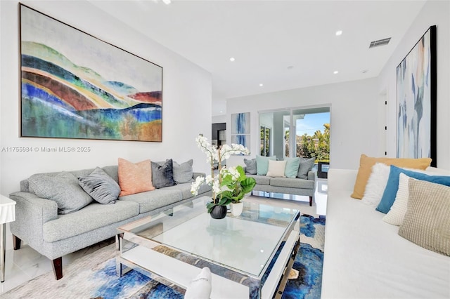 living room with visible vents and recessed lighting