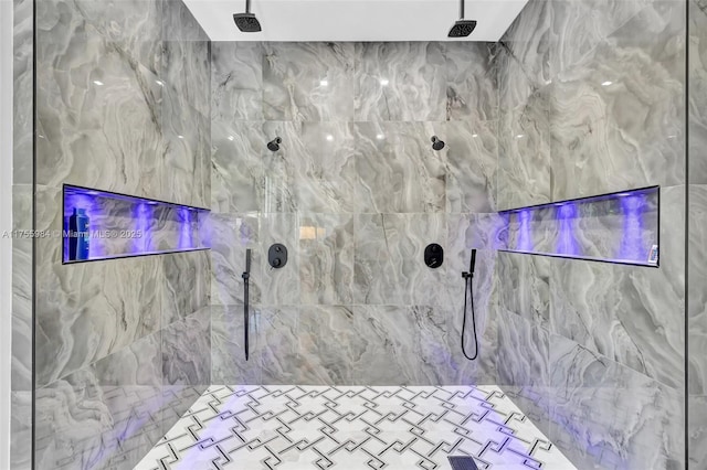 bathroom with tiled shower