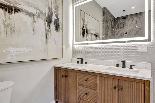 4440 NE 15th Ter, Oakland Park, FL 33334 - full bath with backsplash, double vanity, a sink, and walk in shower