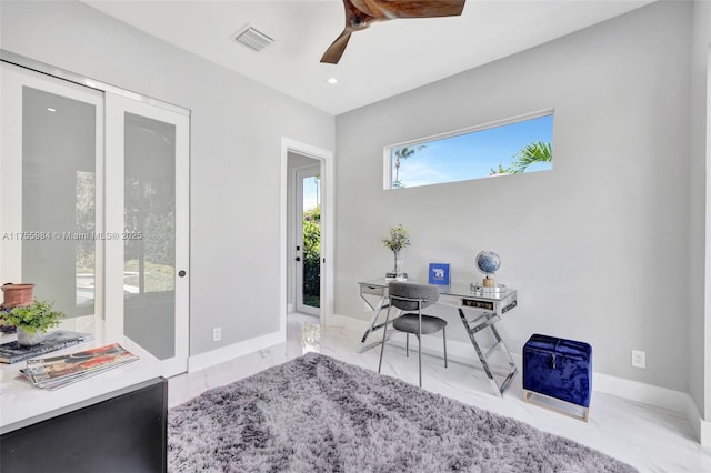 office area featuring visible vents, baseboards, marble finish floor, and ceiling fan