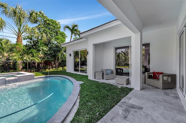 view of swimming pool with an outdoor living space, a patio, a pool with connected hot tub, and a yard