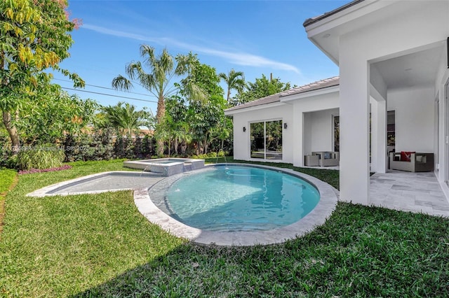 view of pool with a patio, a yard, and a pool with connected hot tub