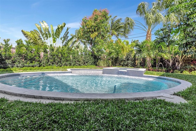 4440 NE 15th Ter, Oakland Park, FL 33334 - view of swimming pool featuring a pool with connected hot tub