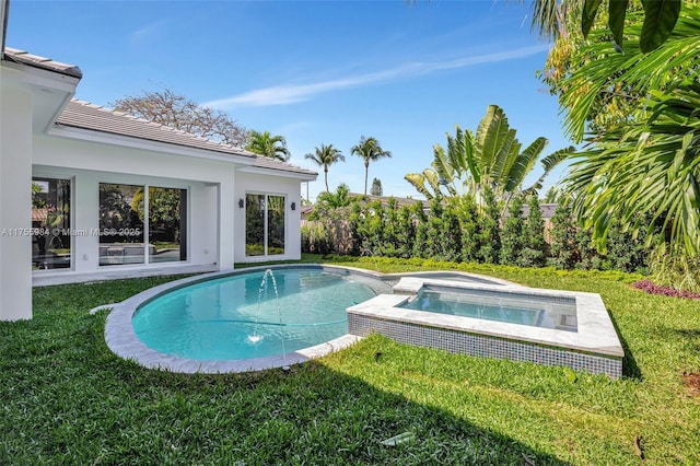 outdoor pool featuring a lawn and an in ground hot tub