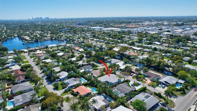 bird's eye view featuring a water view and a residential view