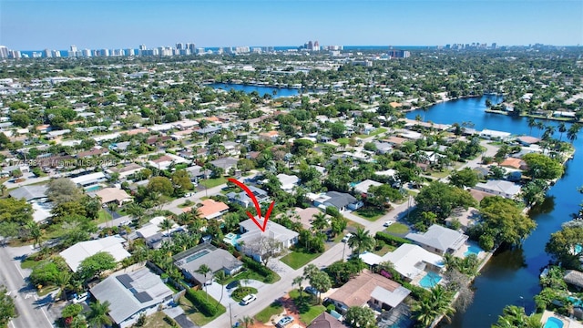 bird's eye view featuring a city view and a water view