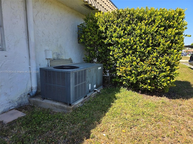 details with central air condition unit and stucco siding