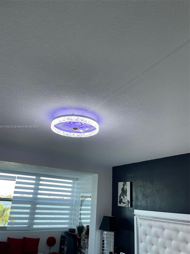 18555 NE 14th Ave Unit 609, Miami, FL 33179 - room details featuring a textured ceiling