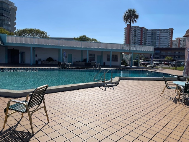 18555 NE 14th Ave Unit 609, Miami, FL 33179 - community pool featuring a patio