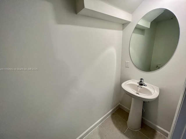 bathroom featuring tile patterned floors and baseboards