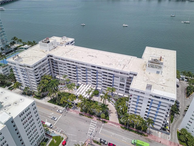 drone / aerial view with a city view and a water view