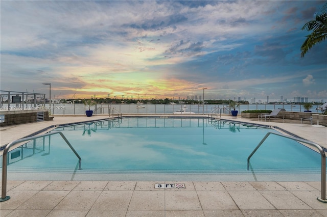 community pool featuring a patio area and fence