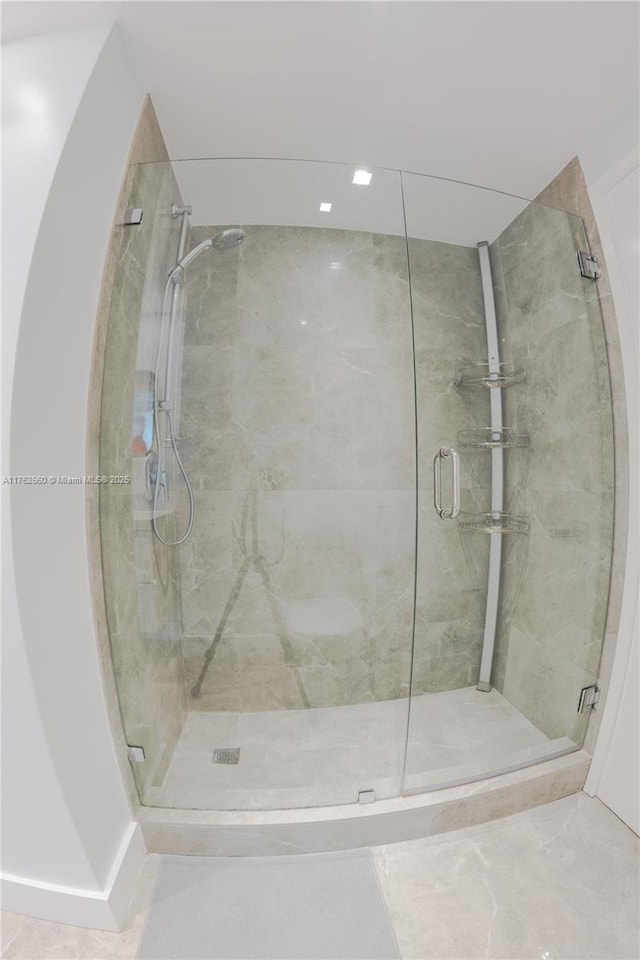 full bath featuring a shower stall