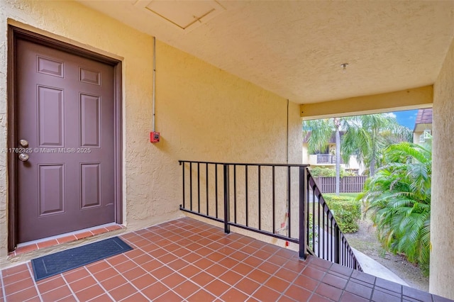 property entrance with stucco siding