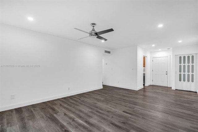 unfurnished living room with recessed lighting, visible vents, baseboards, and dark wood-style floors