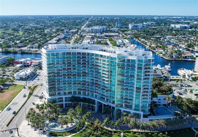 birds eye view of property with a view of city and a water view