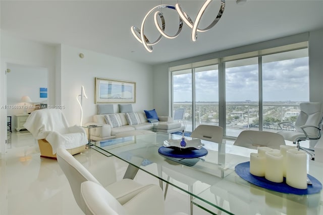 dining space featuring a wall of windows and a notable chandelier