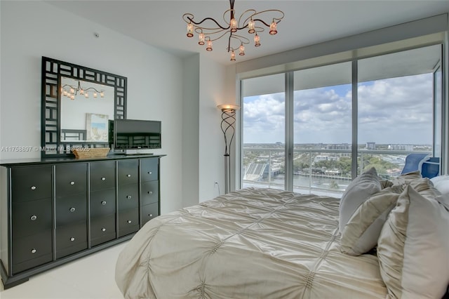 bedroom featuring a chandelier and access to outside