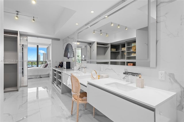 5500 Island Estates Dr Unit 604, Aventura, FL 33160 - ensuite bathroom with double vanity, rail lighting, marble finish floor, ensuite bath, and a sink