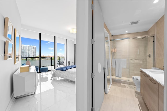 5500 Island Estates Dr Unit 604, Aventura, FL 33160 - ensuite bathroom with vanity, toilet, visible vents, and a stall shower
