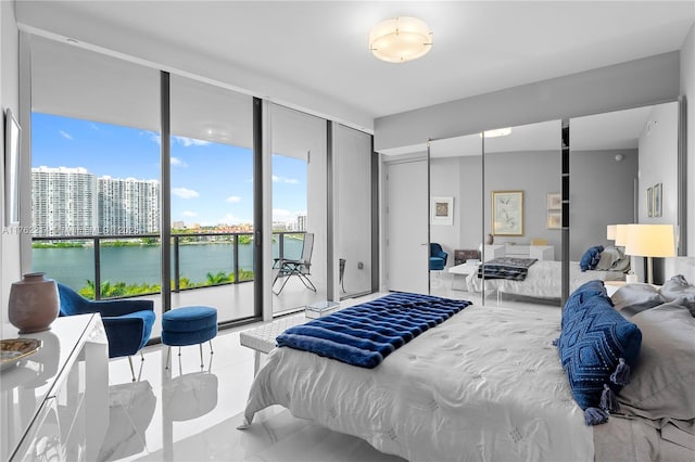5500 Island Estates Dr Unit 604, Aventura, FL 33160 - bedroom featuring floor to ceiling windows, a view of city, and a water view