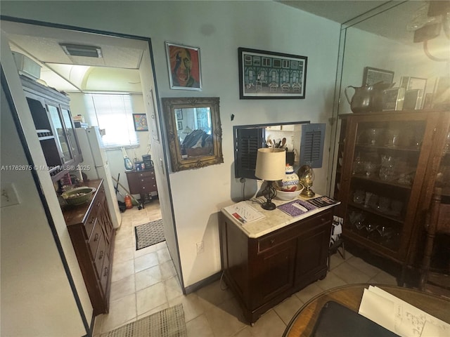 interior space featuring tile patterned flooring and visible vents