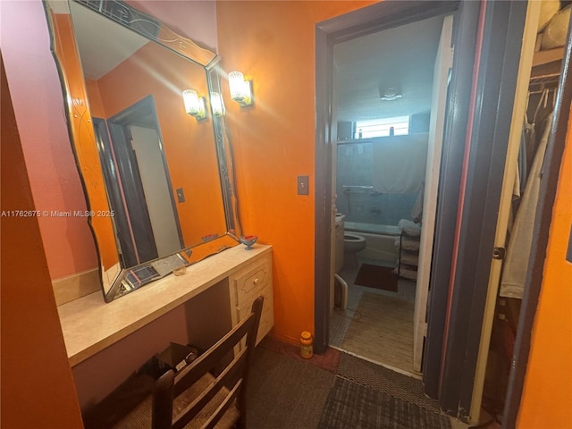 bathroom featuring a bidet, toilet, and vanity