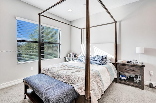 carpeted bedroom featuring baseboards